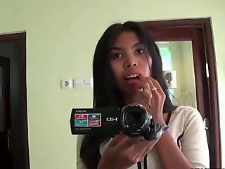 Sexy pessimistic Asian babe fools around with the camera